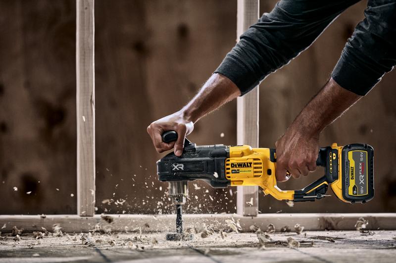 18V Brushless Compact Stud and Joist Drill drilling through floorboards